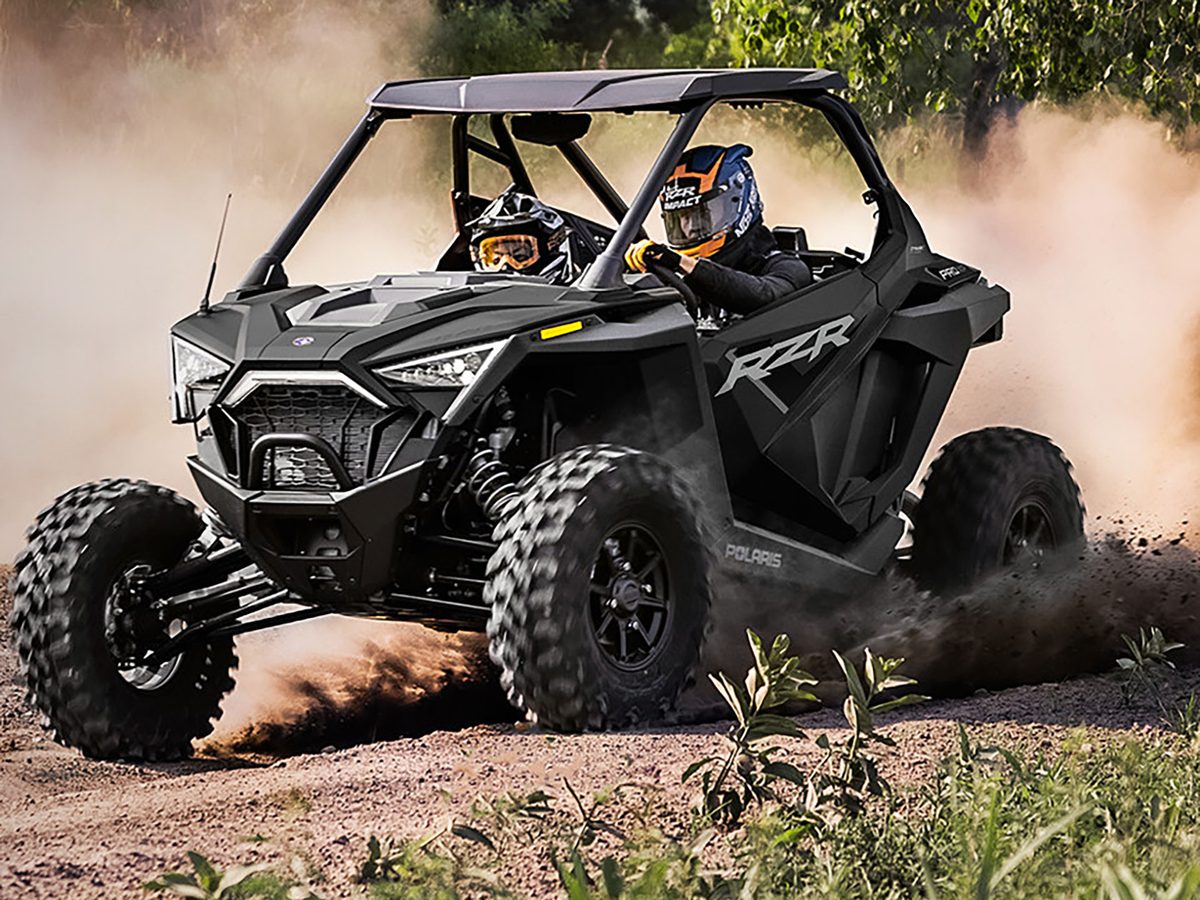 Polaris RZR side-by-side on a dirt trail